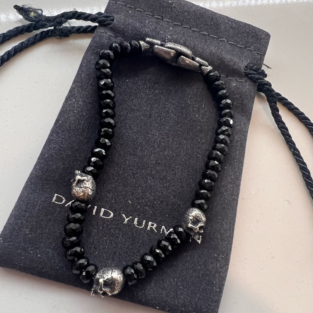 MEMENTO MORI SKULL STATION BRACELET IN STERLING SILVER WITH BLACK SPINEL.